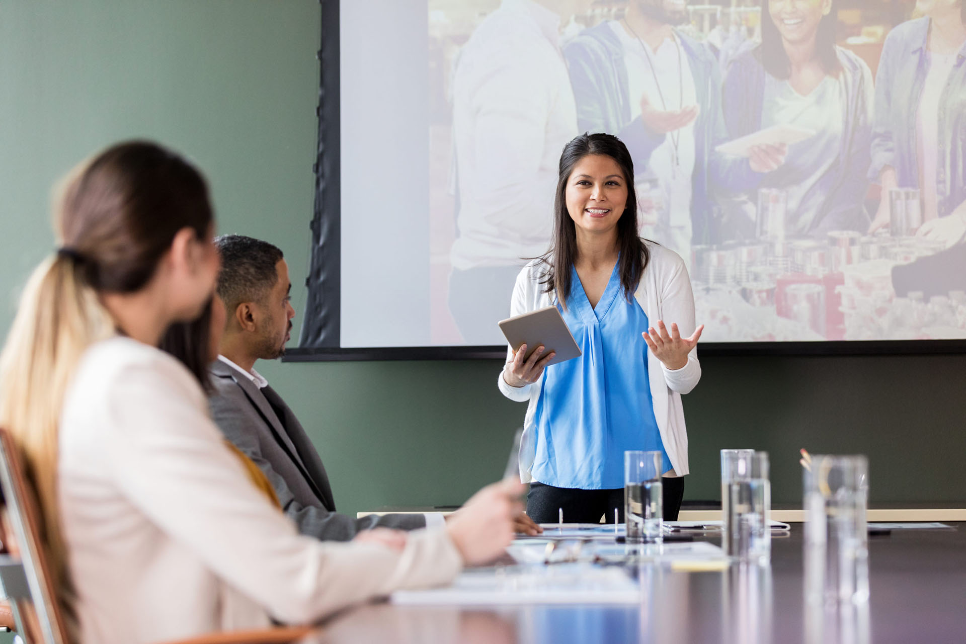 A woman gives a presentation during a committee meeting